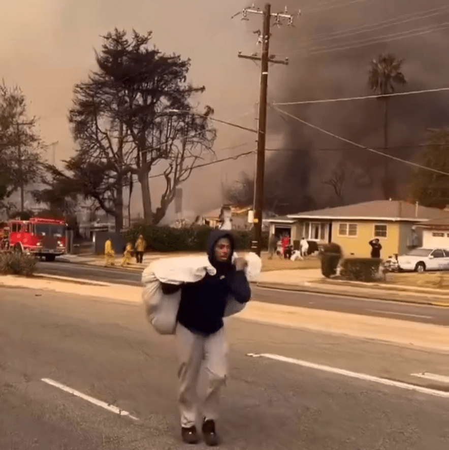 Black People begin looting the abandoned houses as the wildfire rages around&nbsp;them